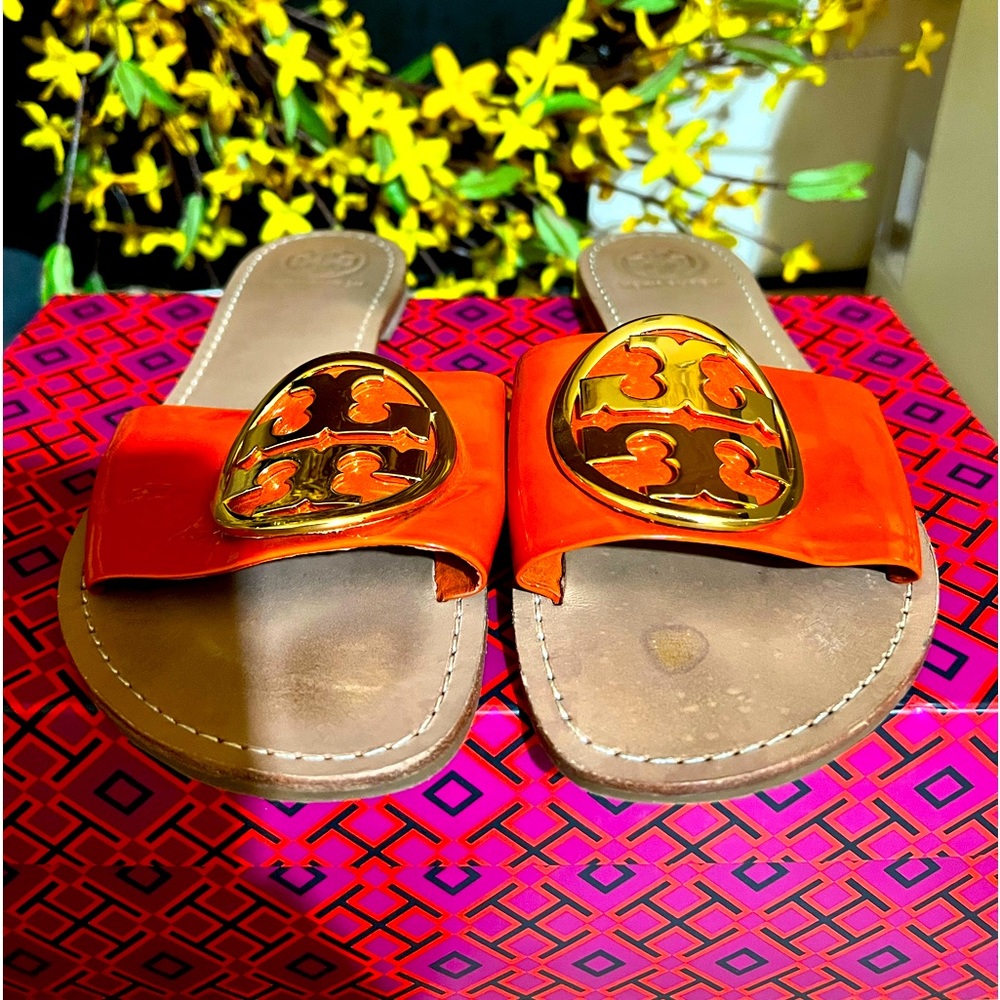 Tory Burch orange flats with gold medallion
